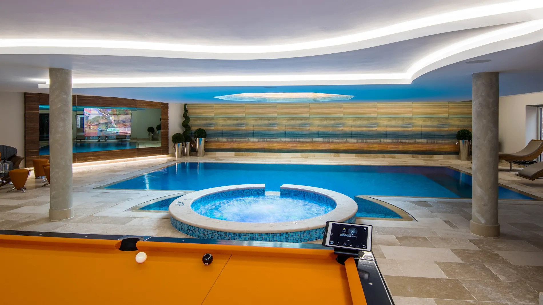 Indoor pool area with jacuzzi.