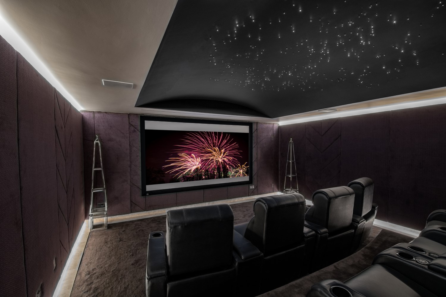 Cozy home theater with surround sound and mood lighting.