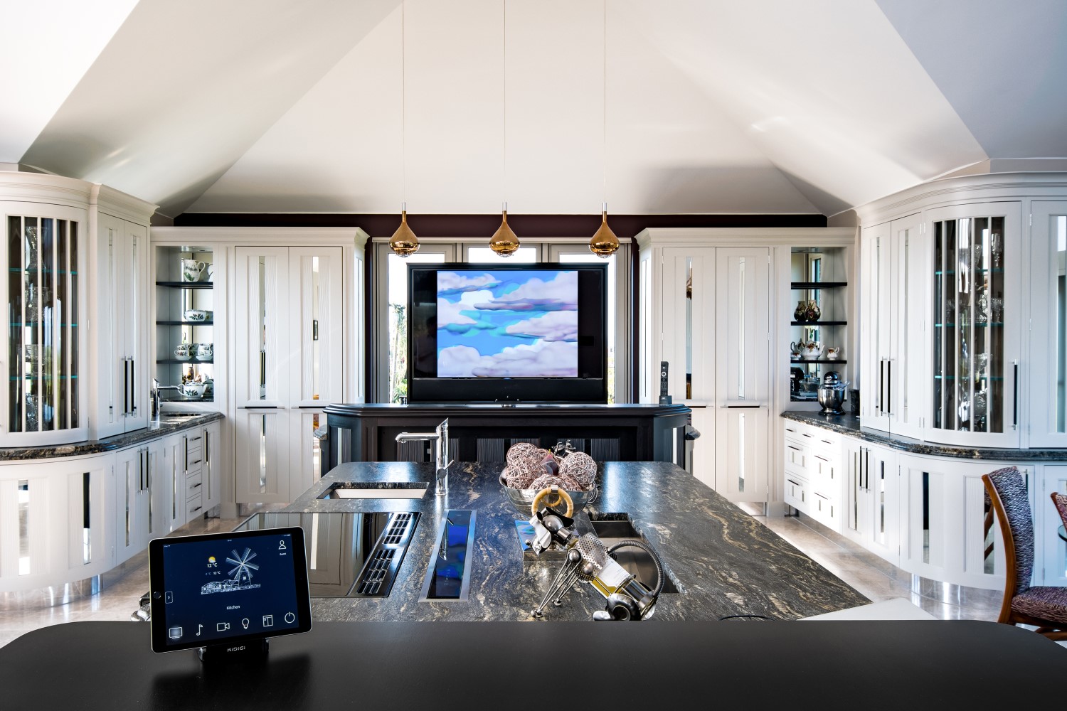 High-end kitchen featuring smart home automation with iPad interface.