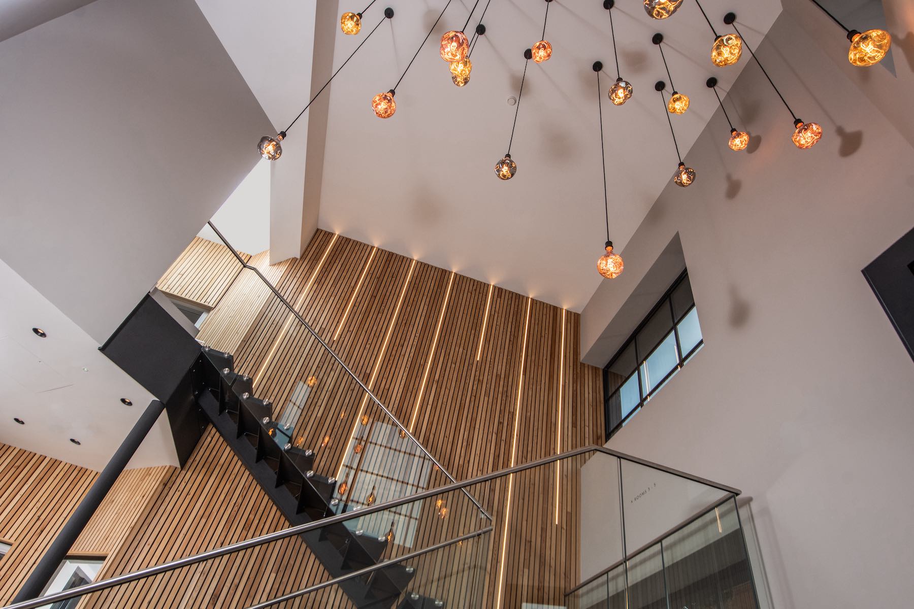 the-old-police-station-aparthotel-horsforth-stairs-hanging-light-fittings